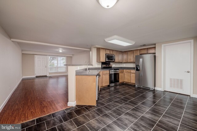 1465 N Van Dorn St, Alexandria, VA 22304 - kitchen featuring a sink, visible vents, stainless steel appliances, baseboards, and a peninsula