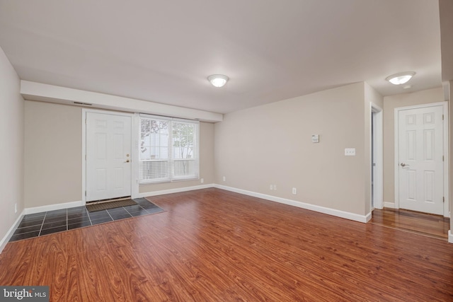 1465 N Van Dorn St, Alexandria, VA 22304 - foyer with baseboards and dark wood-style flooring