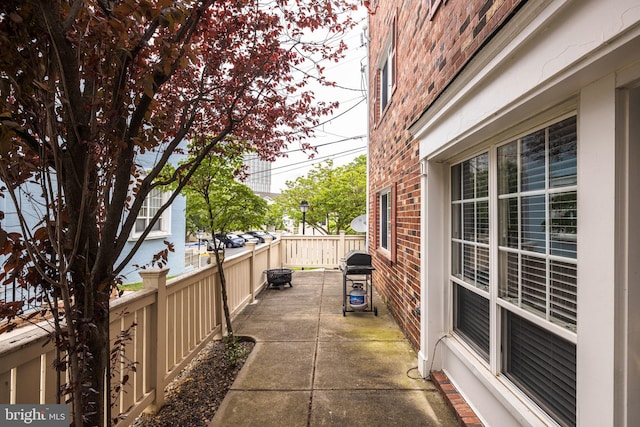 1465 N Van Dorn St, Alexandria, VA 22304 - view of home's exterior with fence, a patio area, and brick siding
