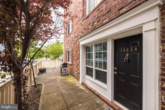 1465 N Van Dorn St, Alexandria, VA 22304 - doorway to property featuring brick siding and fence