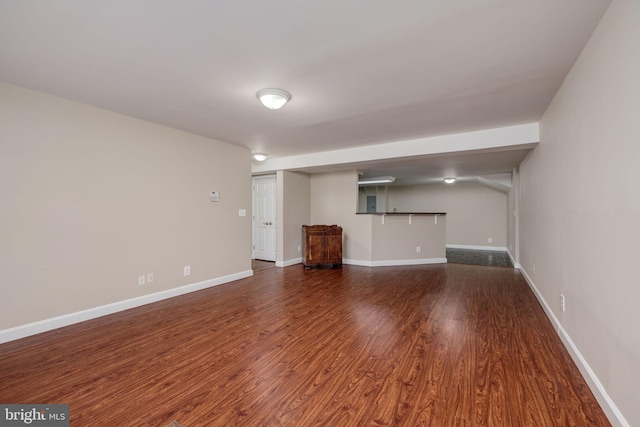1465 N Van Dorn St, Alexandria, VA 22304 - unfurnished living room featuring dark wood-style floors and baseboards
