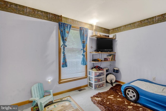 bedroom with baseboards and carpet flooring