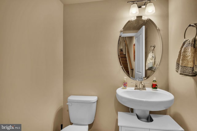 half bathroom featuring toilet