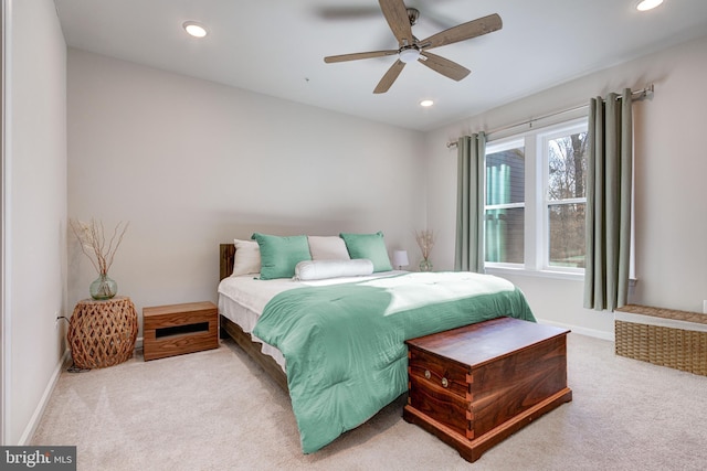 carpeted bedroom featuring baseboards, ceiling fan, and recessed lighting