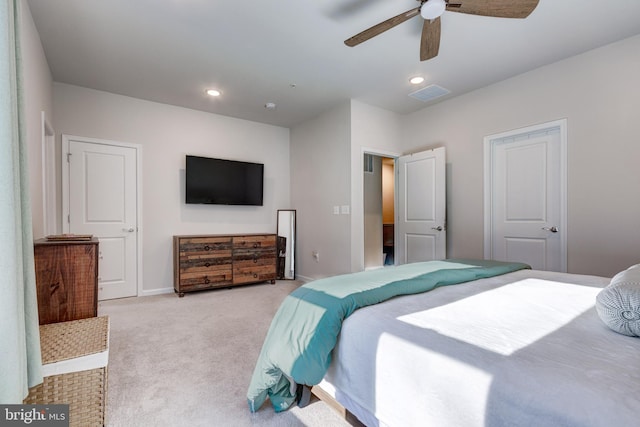 bedroom featuring visible vents, baseboards, recessed lighting, a ceiling fan, and light carpet