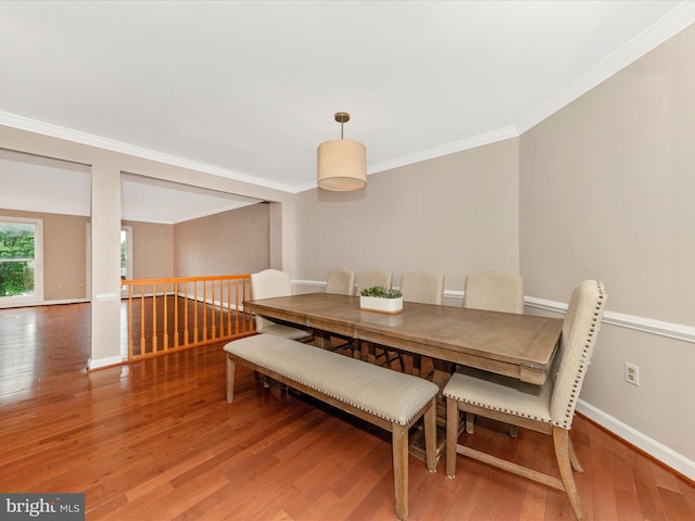 6093 Baldridge Ct, Frederick, MD 21701 - dining room with wood finished floors, crown molding, and baseboards
