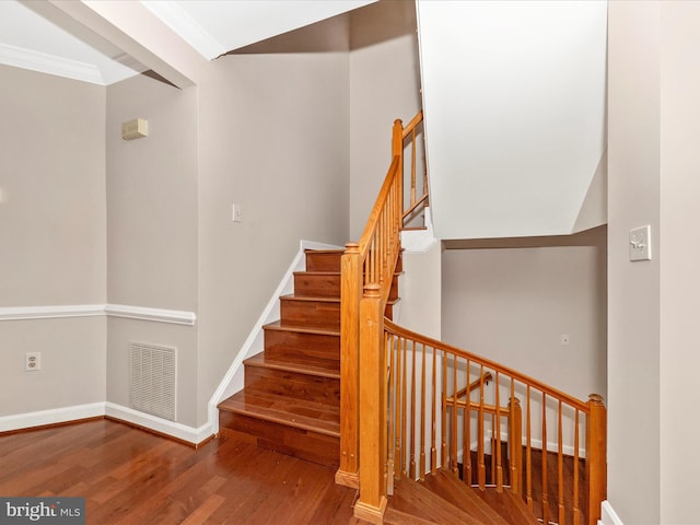 6093 Baldridge Ct, Frederick, MD 21701 - stairs featuring wood finished floors, crown molding, and baseboards