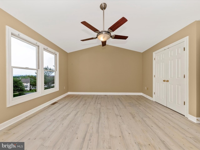 6093 Baldridge Ct, Frederick, MD 21701 - unfurnished bedroom featuring lofted ceiling, light wood-style floors, baseboards, a closet, and ceiling fan