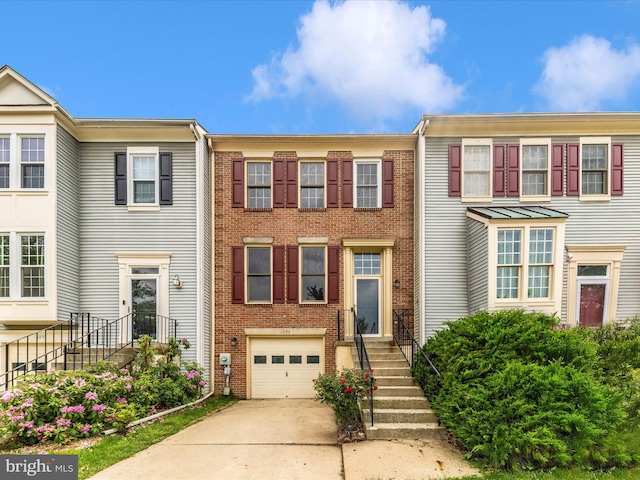 6093 Baldridge Ct, Frederick, MD 21701 - view of property with driveway, an attached garage, and brick siding