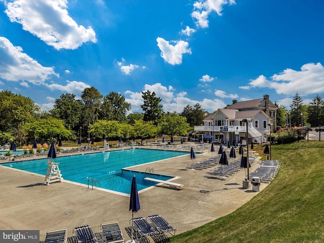 6093 Baldridge Ct, Frederick, MD 21701 - community pool with a lawn, a patio, and view of scattered trees