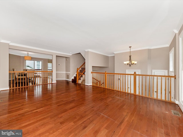 6093 Baldridge Ct, Frederick, MD 21701 - spare room with a chandelier, wood finished floors, ornamental molding, and baseboards