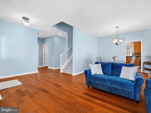 1121 Old Love Point Rd, Stevensville, MD 21666 - living area featuring recessed lighting, an inviting chandelier, wood finished floors, baseboards, and stairs