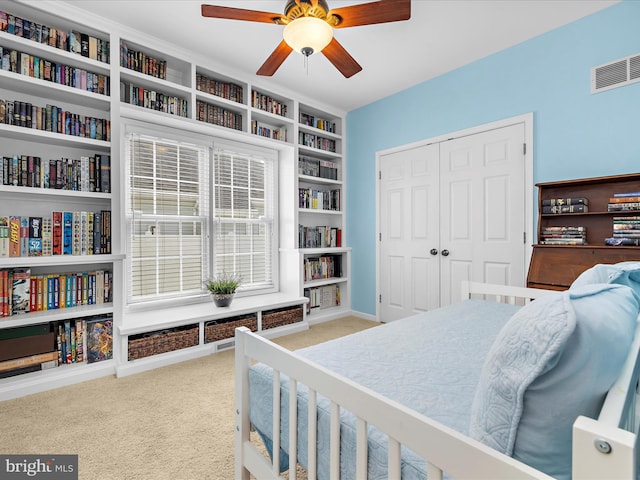 1121 Old Love Point Rd, Stevensville, MD 21666 - carpeted bedroom with ceiling fan, visible vents, and a closet