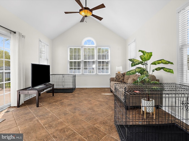 1121 Old Love Point Rd, Stevensville, MD 21666 - living area with lofted ceiling, plenty of natural light, a ceiling fan, and baseboards
