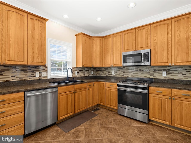 1121 Old Love Point Rd, Stevensville, MD 21666 - kitchen featuring dark countertops, ornamental molding, a sink, tasteful backsplash, and appliances with stainless steel finishes