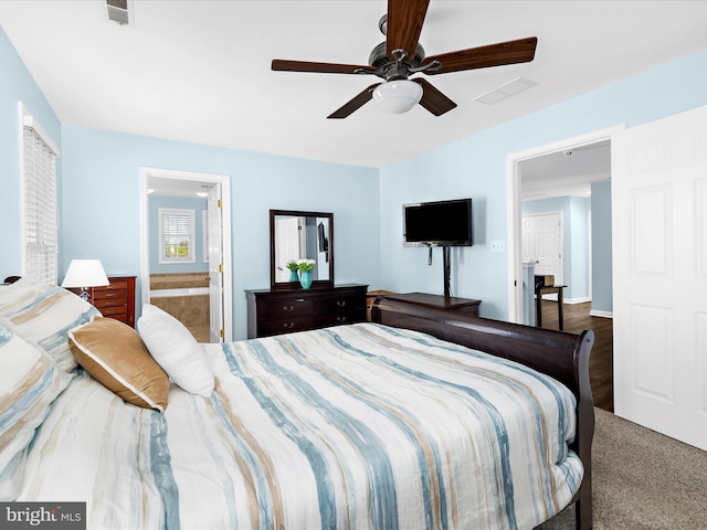 1121 Old Love Point Rd, Stevensville, MD 21666 - bedroom with visible vents, a ceiling fan, and connected bathroom