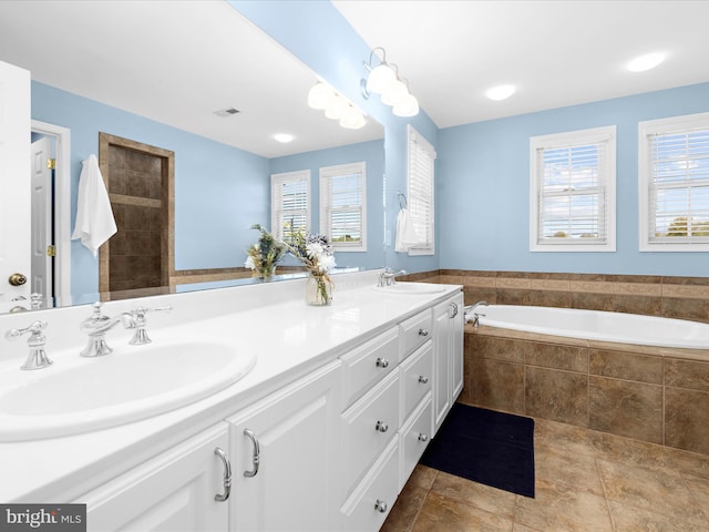 1121 Old Love Point Rd, Stevensville, MD 21666 - bathroom featuring a bath, visible vents, a sink, and double vanity