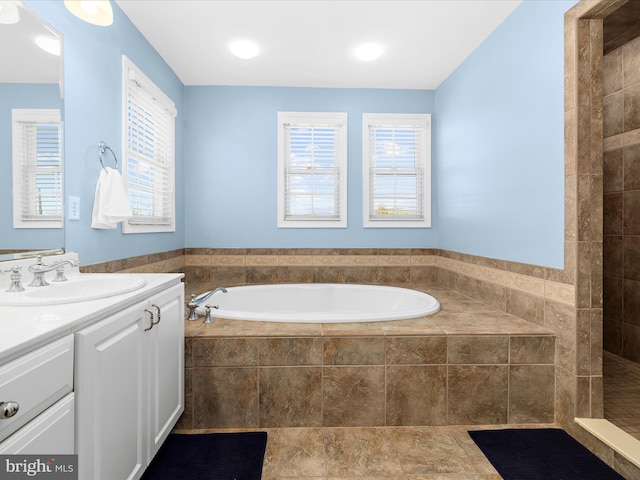 1121 Old Love Point Rd, Stevensville, MD 21666 - full bath featuring a garden tub, a healthy amount of sunlight, and vanity