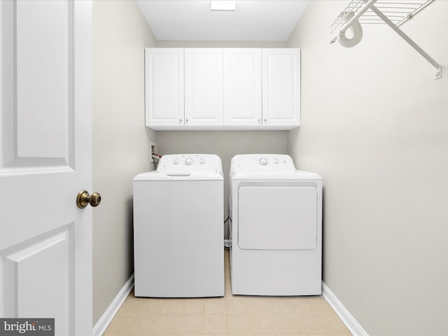 1121 Old Love Point Rd, Stevensville, MD 21666 - washroom featuring cabinet space, independent washer and dryer, baseboards, and light tile patterned floors