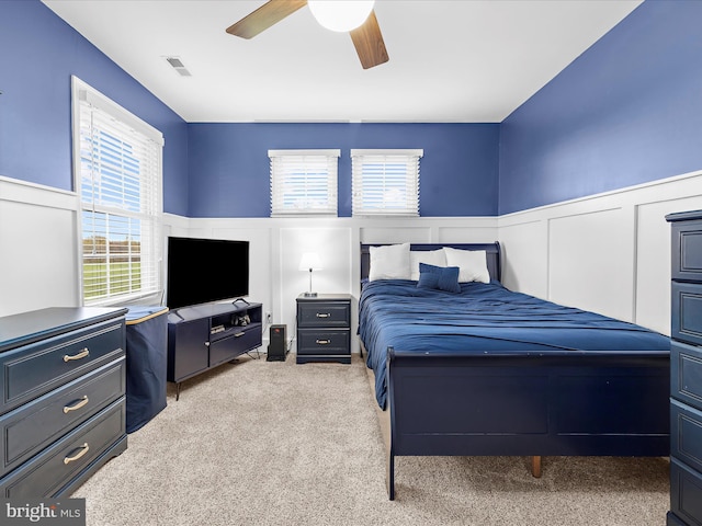 1121 Old Love Point Rd, Stevensville, MD 21666 - bedroom with carpet, visible vents, multiple windows, and wainscoting