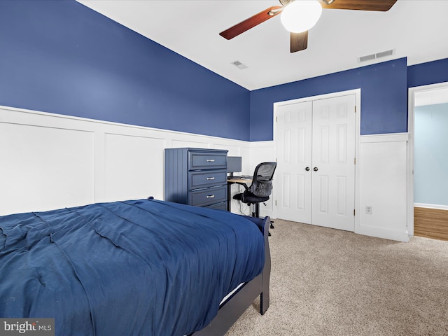 1121 Old Love Point Rd, Stevensville, MD 21666 - bedroom with a decorative wall, visible vents, carpet flooring, and wainscoting