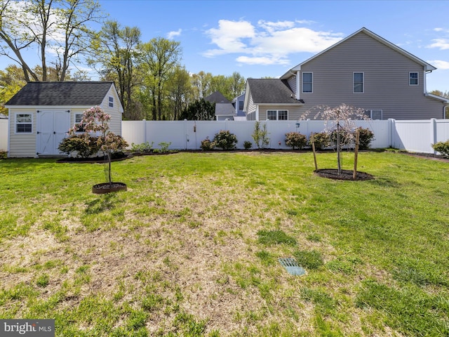 1121 Old Love Point Rd, Stevensville, MD 21666 - view of yard with a fenced backyard, an outdoor structure, and a storage shed