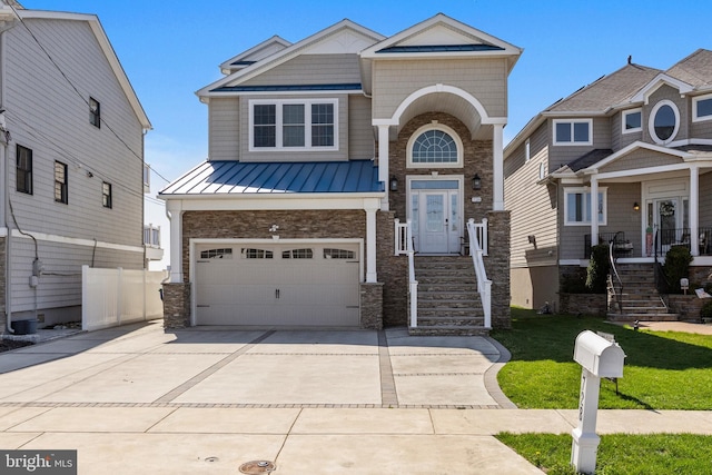 view of front of property featuring stone siding, metal roof, a garage, concrete driveway, and a standing seam roof