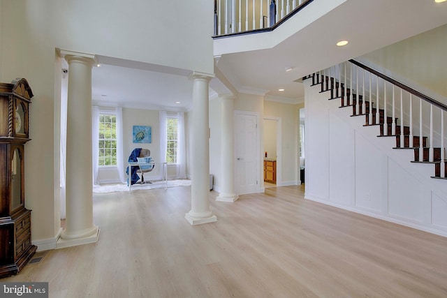 8177 Bodkin Ave, Pasadena, MD 21122 - entrance foyer with ornate columns and light wood-type flooring