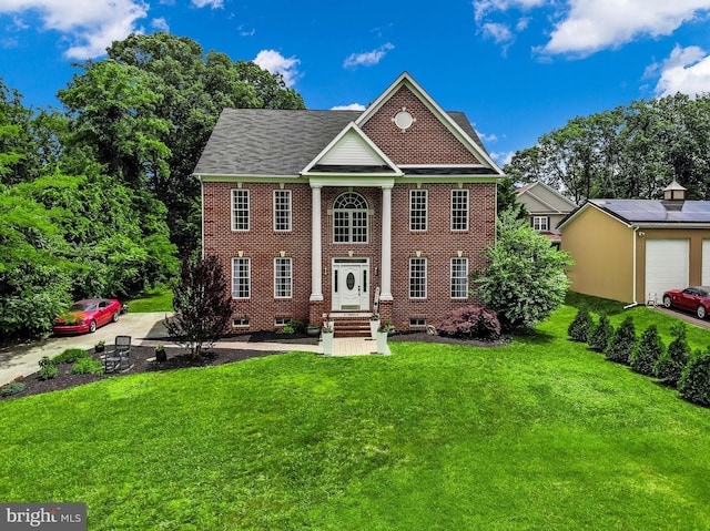 8177 Bodkin Ave, Pasadena, MD 21122 - view of front facade with brick siding, a front yard, and entry steps