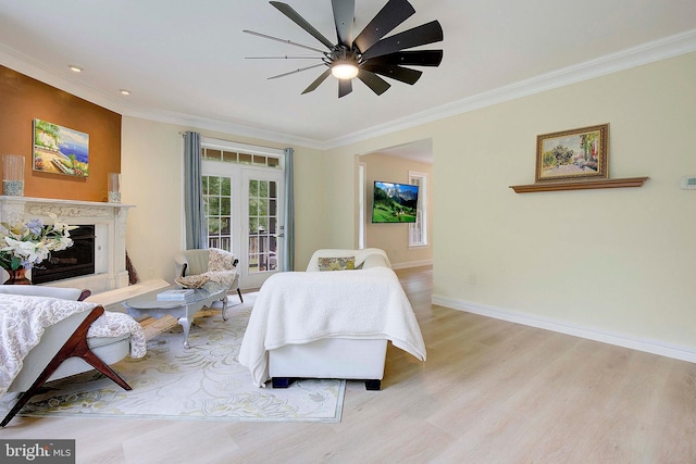 8177 Bodkin Ave, Pasadena, MD 21122 - interior space with access to exterior, crown molding, baseboards, light wood finished floors, and a premium fireplace