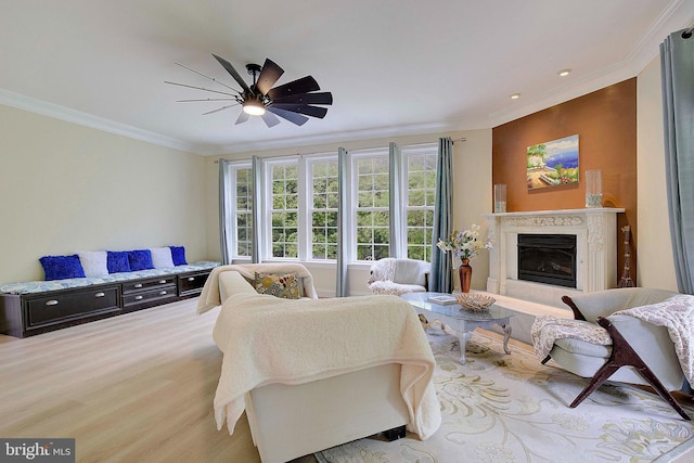 8177 Bodkin Ave, Pasadena, MD 21122 - living area featuring crown molding, wood finished floors, a fireplace, recessed lighting, and a ceiling fan