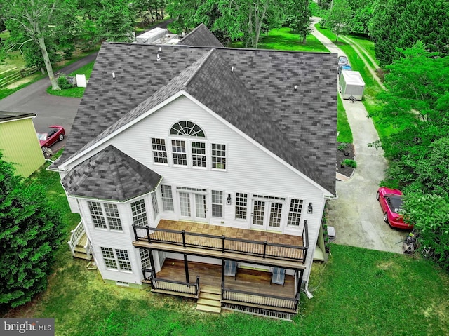8177 Bodkin Ave, Pasadena, MD 21122 - back of house with a lawn, a deck, and a shingled roof