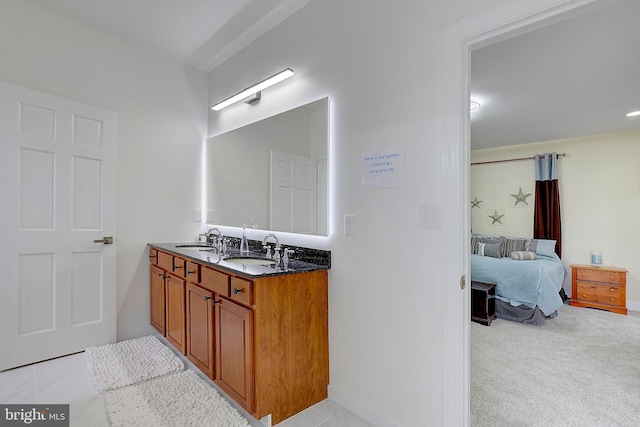 8177 Bodkin Ave, Pasadena, MD 21122 - full bath with connected bathroom, double vanity, baseboards, and a sink