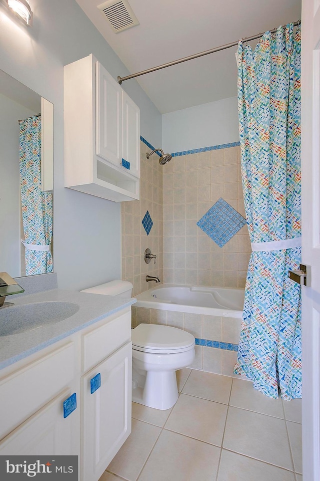 8177 Bodkin Ave, Pasadena, MD 21122 - full bath with visible vents, tile patterned floors, tiled shower / bath, vanity, and toilet