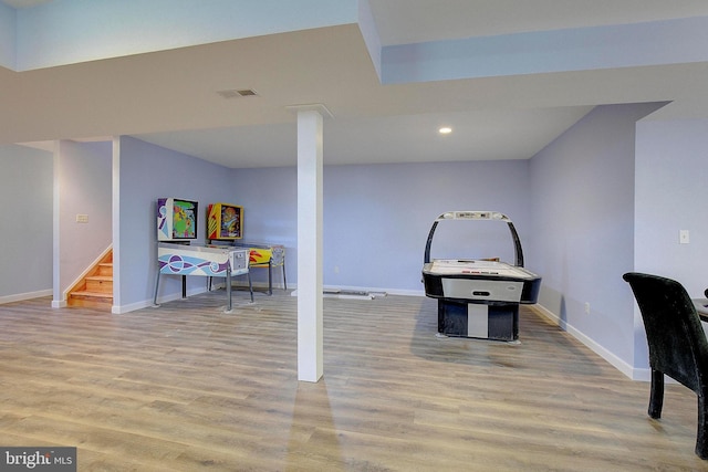 8177 Bodkin Ave, Pasadena, MD 21122 - rec room with baseboards, wood finished floors, and visible vents