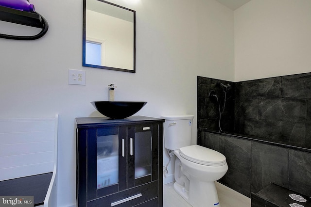 8177 Bodkin Ave, Pasadena, MD 21122 - full bathroom with vanity, a tile shower, and toilet
