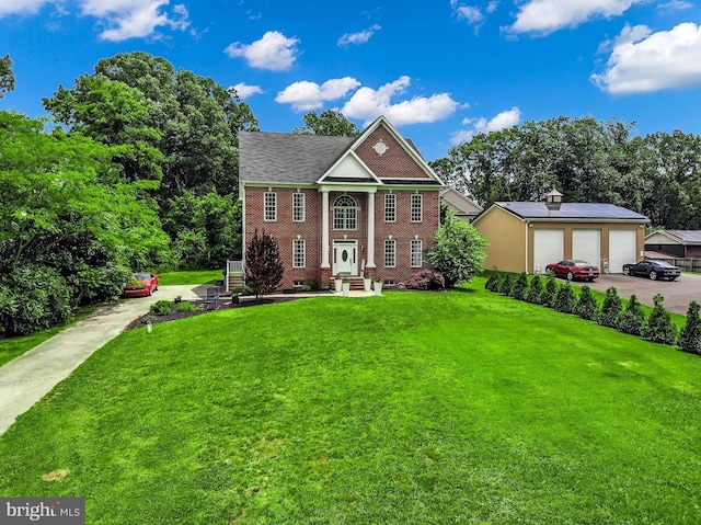 8177 Bodkin Ave, Pasadena, MD 21122 - view of front facade with a garage, an outbuilding, a front yard, and brick siding