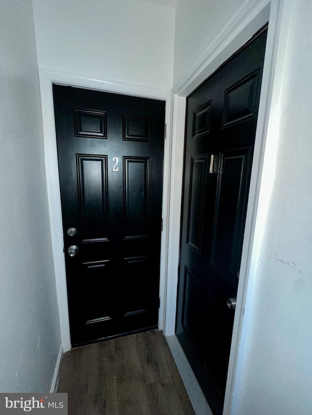 doorway to outside with dark wood finished floors