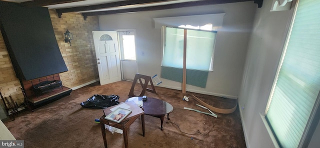 8323 Bear Creek Dr, Baltimore, MD 21222 - unfurnished living room featuring carpet, a wealth of natural light, and beam ceiling