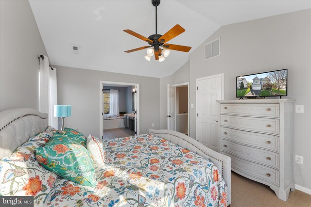 bedroom with high vaulted ceiling, ensuite bathroom, ceiling fan, light colored carpet, and visible vents