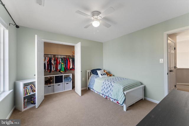 bedroom with baseboards, a ceiling fan, visible vents, and carpet