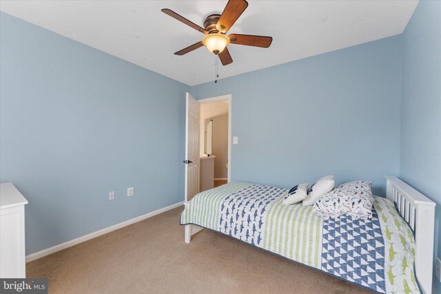 carpeted bedroom with baseboards and ceiling fan