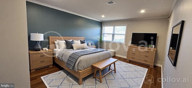 bedroom featuring ornamental molding, dark wood-style floors, baseboards, and visible vents
