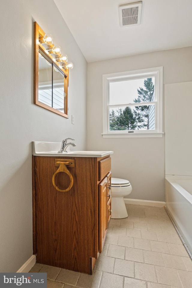 103 Cromwell Ave, Glen Burnie, MD 21061 - bathroom with toilet, vanity, a tub, baseboards, and visible vents