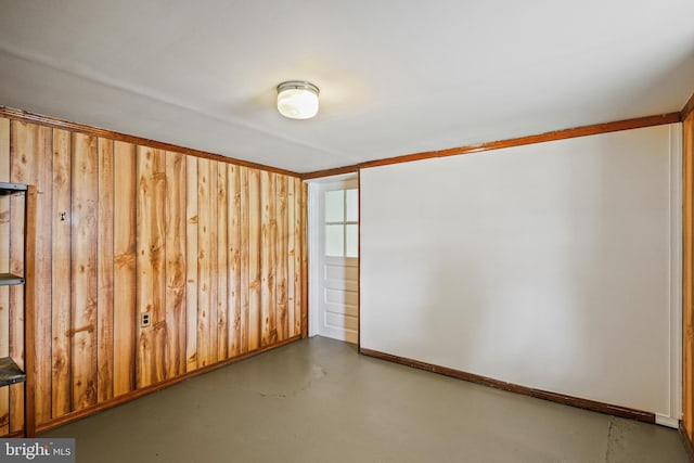 103 Cromwell Ave, Glen Burnie, MD 21061 - empty room with baseboards, wooden walls, and finished concrete floors