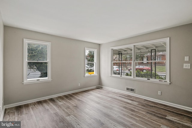 103 Cromwell Ave, Glen Burnie, MD 21061 - spare room with baseboards, visible vents, and wood finished floors