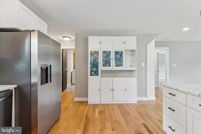 19316 Landora Bridge Rd, Ruther Glen, VA 22546 - kitchen featuring appliances with stainless steel finishes, white cabinets, and light wood finished floors