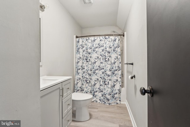 19316 Landora Bridge Rd, Ruther Glen, VA 22546 - full bath featuring wood finished floors, toilet, vanity, and shower / bath combo with shower curtain