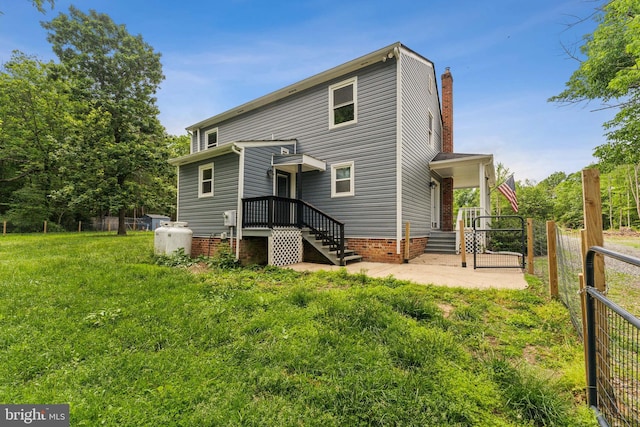 19316 Landora Bridge Rd, Ruther Glen, VA 22546 - back of house featuring fence and a chimney