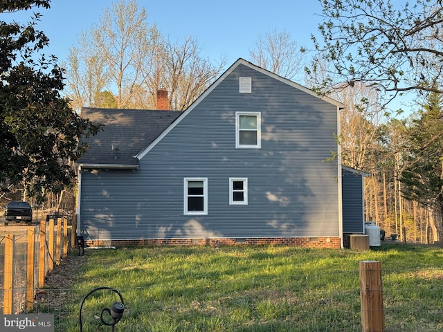 19316 Landora Bridge Rd, Ruther Glen, VA 22546 - rear view of house with a chimney, cooling unit, crawl space, and a shingled roof